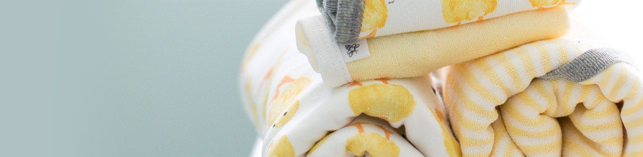 Burt's Bees Baby: Image of rolled Burt's Bees Baby Little Ducks Washcloths and Hooded Towels