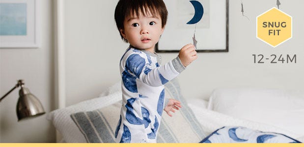 Baby wearing Burt's Bees Baby Hello Moon! print organic cotton snug fit pajamas